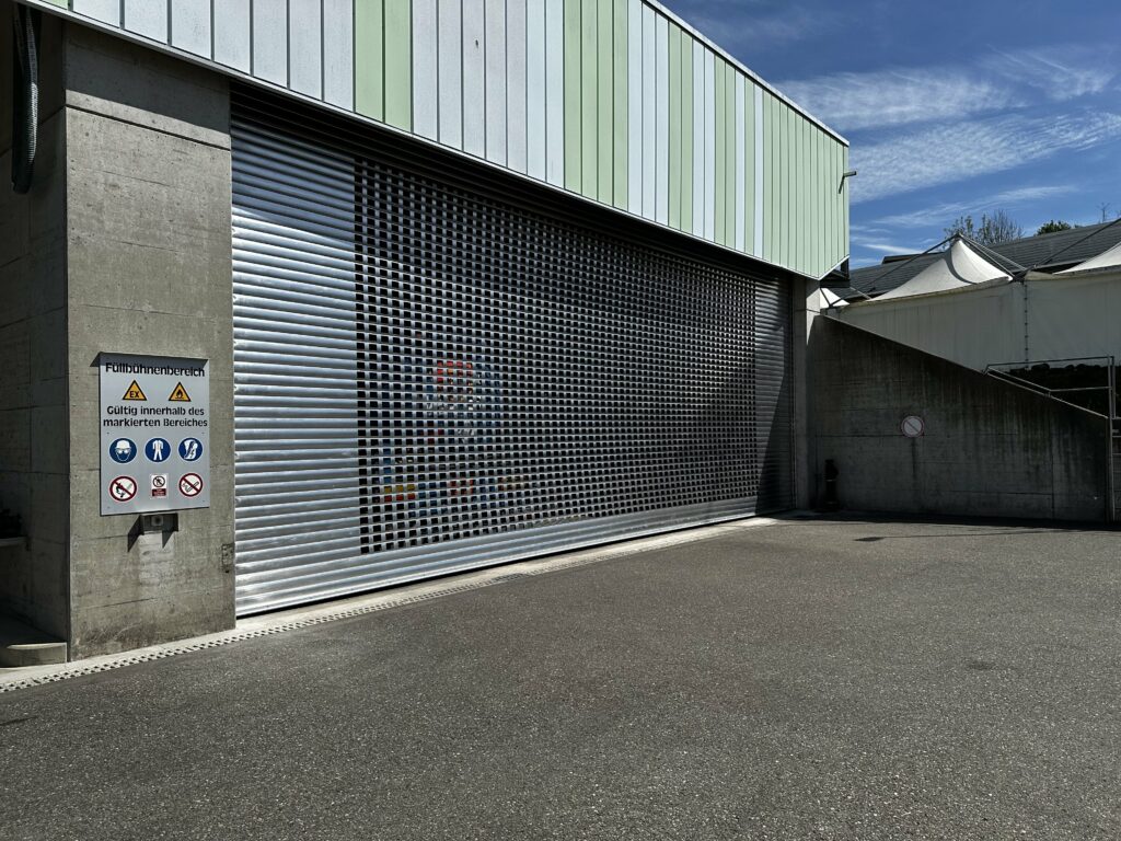 a garage door with a sign on the side